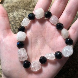 Clear or very light pink quartz and black onyx stretch bracelet